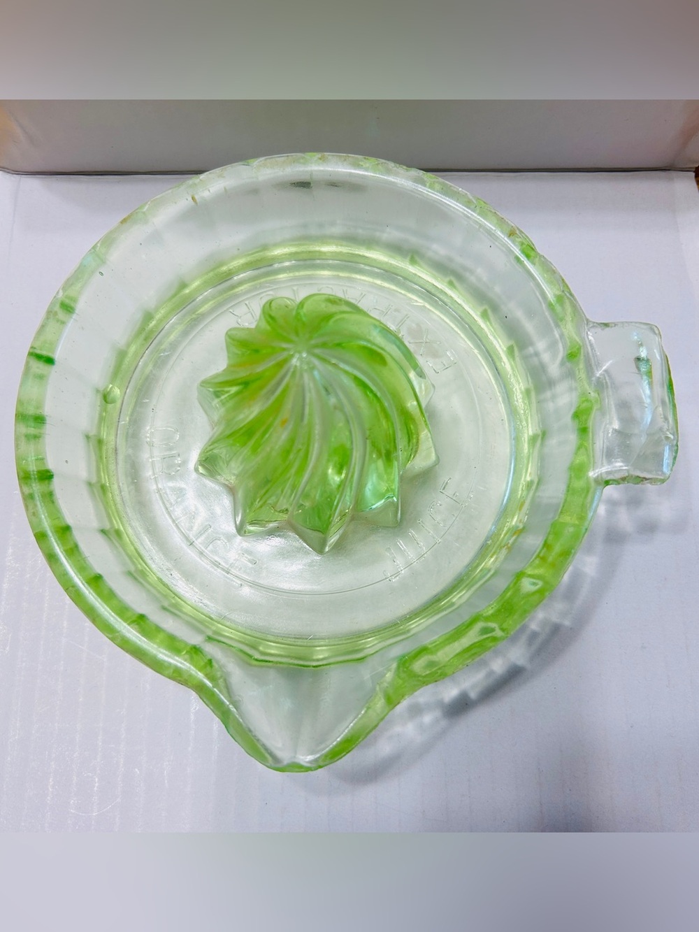 Vintage uranium glass orange juice extractor.